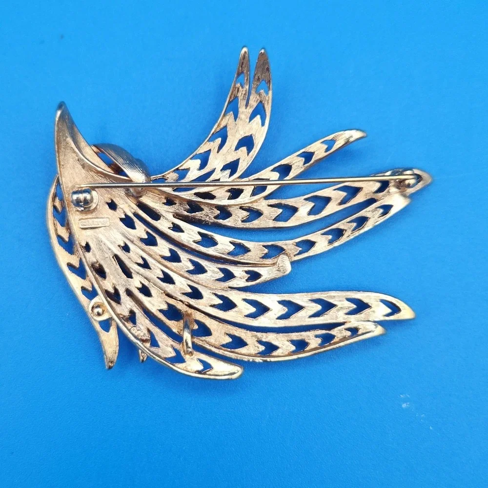 Vintage Monet Gold Tone Abstract Spray Brooch Textured Openwork Wing Pin
